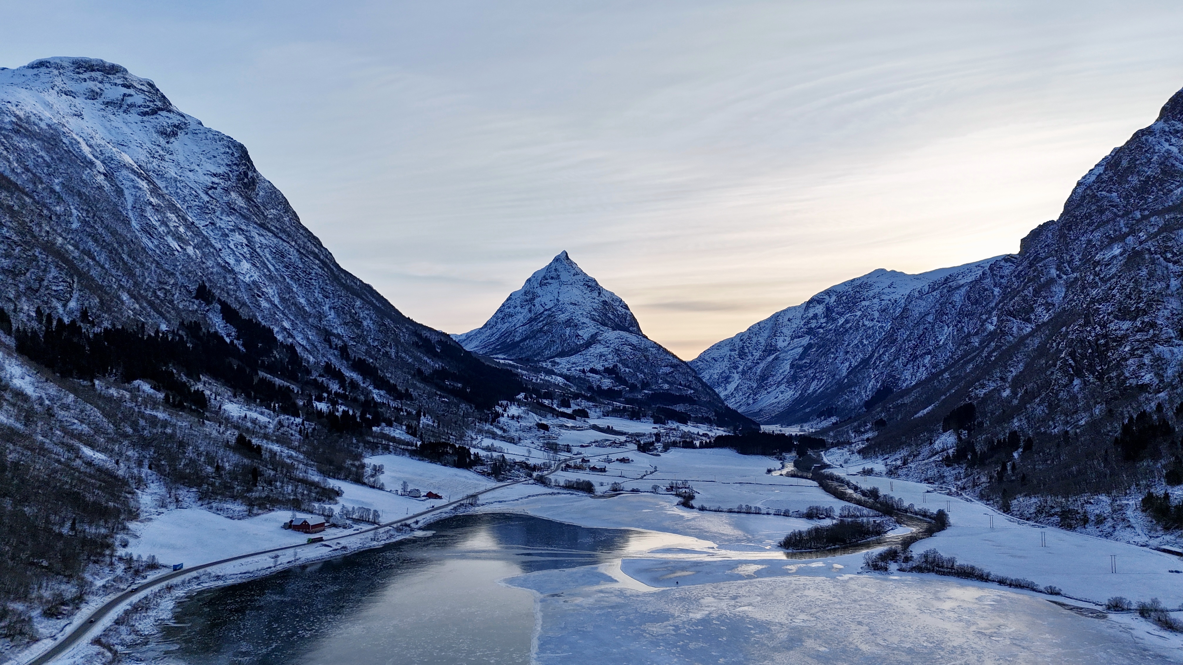 Dramatic mountain valley with frozen river